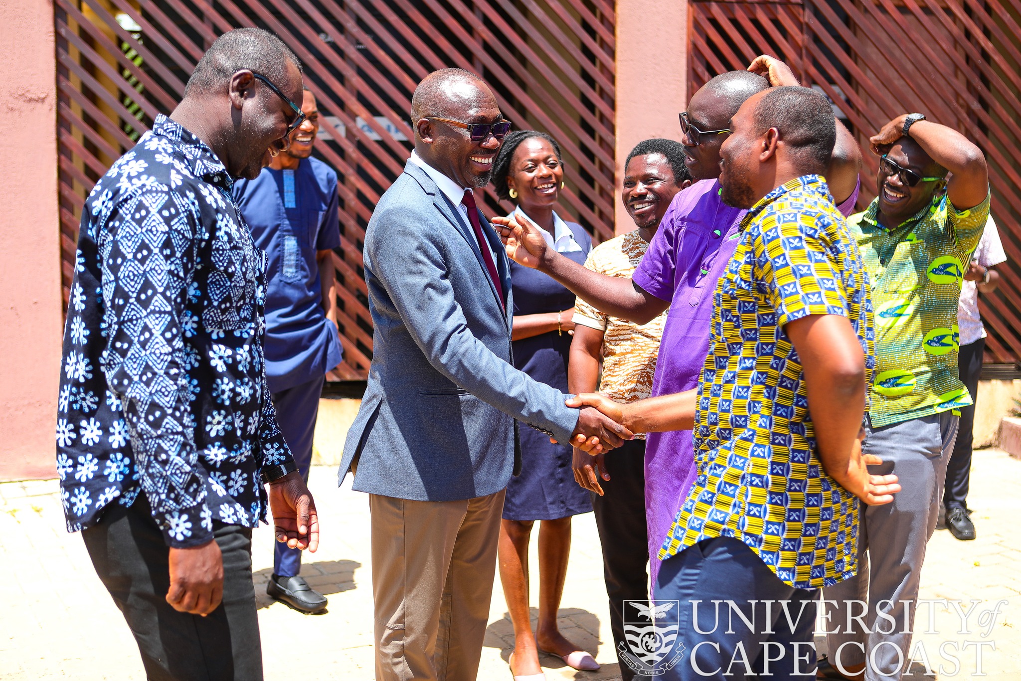 Prof. Denis Aheto(in suit) - Acting Vice-Chancellor, sharing handshake with some faculty members of SoPPS